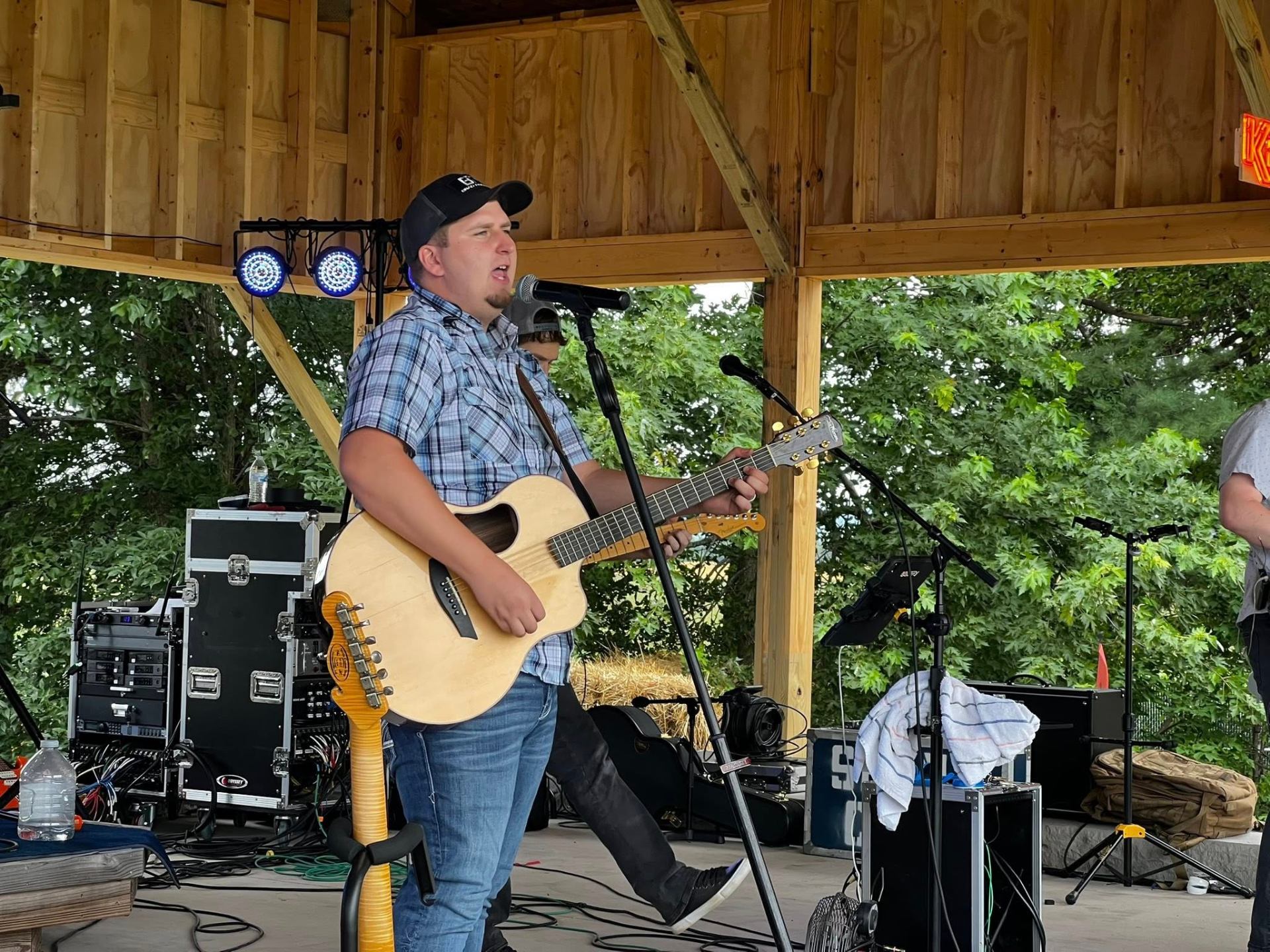 Headlining act performing on stage under blue and amber lights